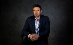 Actor Ben Affleck Sitting On Chair