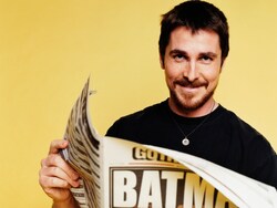 Actor Christian Bale Reading Newspaper