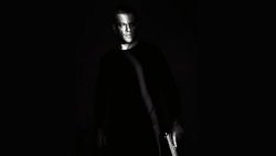 Matt Damon Holding Gun In Hand 4K Black Wallpaper