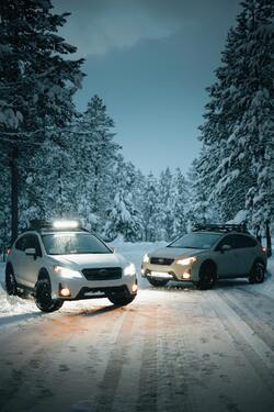 Two White Subaru Suvs Car on Snow Covered Road