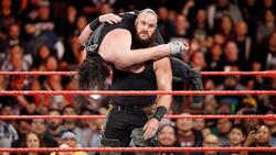 Wrestler Strowman in Action With Roman Reigns
