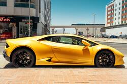 Yellow Lamborghini Parked Beside Road 4K