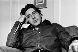 Young Al Pacino Sitting On Sofa Black And White Wallpaper