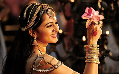 Anushka Shetty Holding A Flower