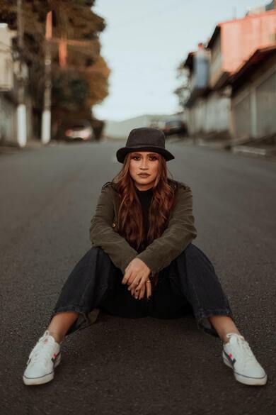 Beautiful Girl Sitting on Road