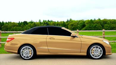 Beige Sedan on Gray Asphalt Road