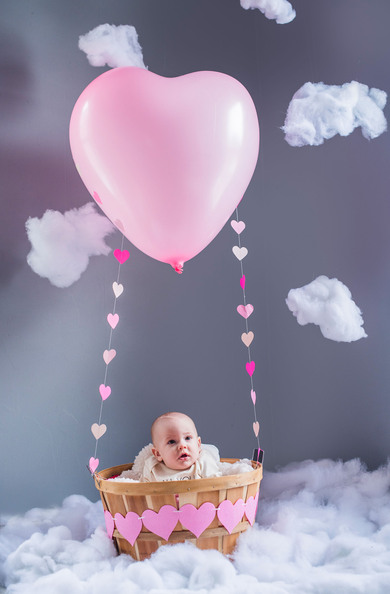 Cute Baby in Balloon Parachute