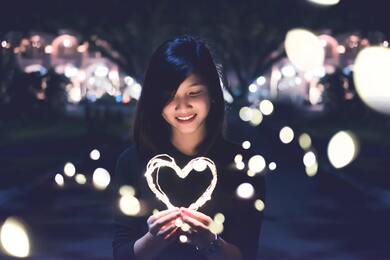 Girl With Heart Light on Hand