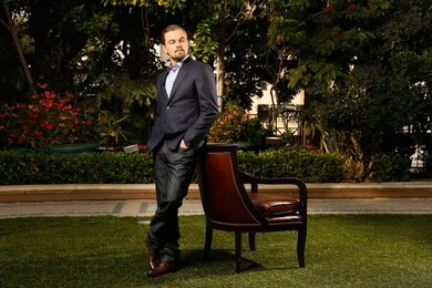 Leonardo Dicaprio Standing Beside Chair In Garden