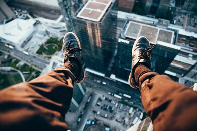 Man Seating on Rooftop