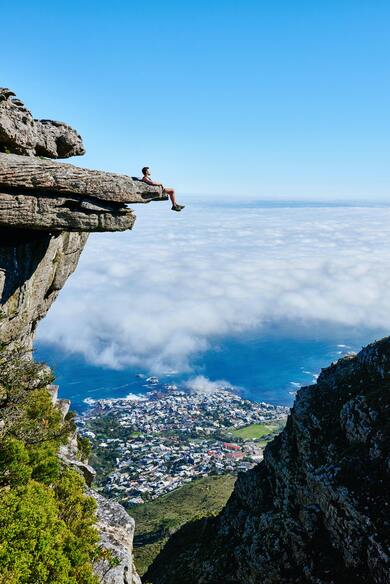 Man Sitting on Rock