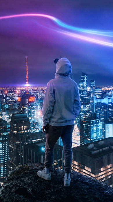 Man Watching Night View of City