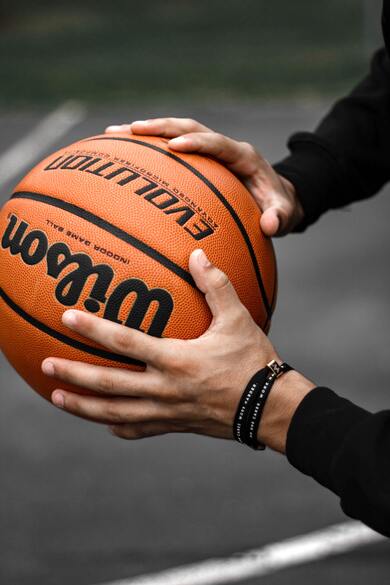 Men Holding Basketball