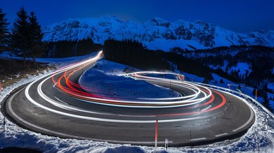 Photography of Curved Lighting Road