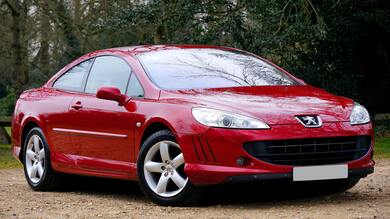 Red Peugeot Sedan Car