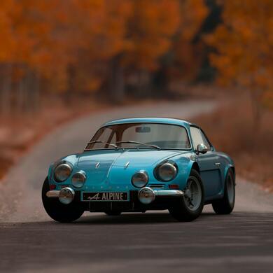 Shallow Focus Photography of Blue Alpine Car