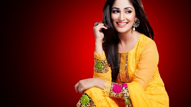 Smiling Yami Gautam In Yellow Dress