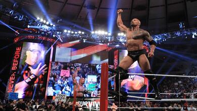 The Rock Raising His Hand in Ring