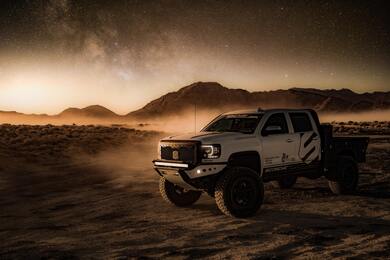 White Crew Cab Pickup Truck on Desert