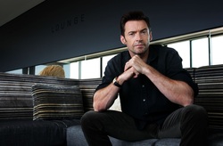 Actor Hugh Jackman Sitting On Couch