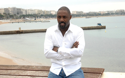 Actor Idris Elba Sitting Near Beach