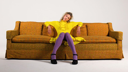 Actress Lili Reinhart Sitting on Sofa