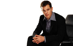 American Actor Matt Damon Sitting On Chair