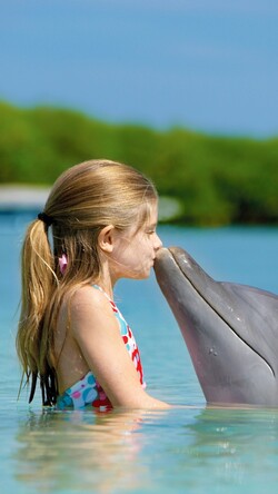 Baby Girl Kissing Dolphin Mobile Photo