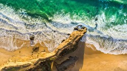 Beach Rocks Drone View 5K Wallpaper