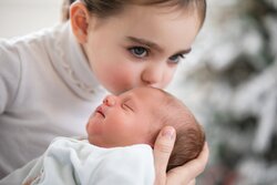 Big Sister Kisses Cute Baby