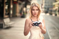 Blonde Girl Holding Camera