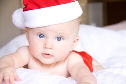 Charming Baby Boy in Santa Cloth