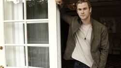 Chris Hemsworth Standing Beside Window