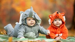 Cute Babies Lying on Green Carpet