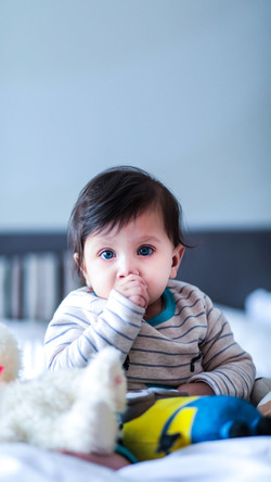 Cute Baby Boy on Bed Photo