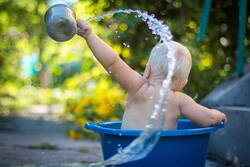 Cute Baby Playing with Water