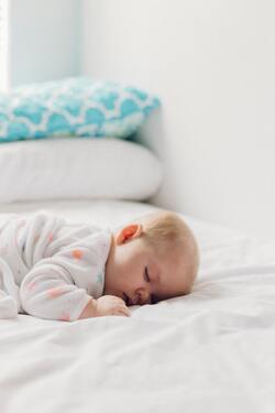 Cute Baby Sleeping on Bed