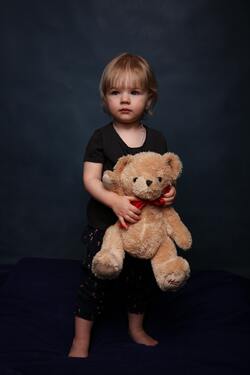 Cute Little Girl With Her Teddy Bear