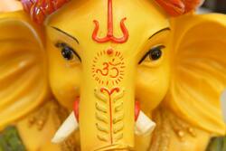 Ganesha Yellow Idol 5K Wallpaper