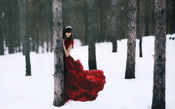 Girl in Red Dress in Snow