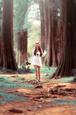 Girl in White Dress Walking in Forest