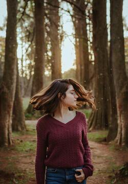 Girl Playing With Hairs in Forest