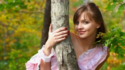 Girl With Smile Posing With Tree