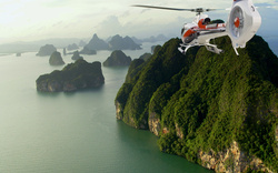 Helicopter Flying Over Island