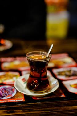 Hot Coffee With Spoon on Table in Cafe