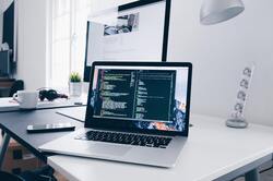 Laptop on White Desk Photo