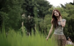 Lovely Girl in Green Grass
