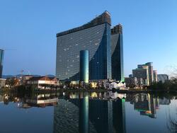 Modern Multistage Building Facades Reflecting in River in City