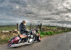 Old Man Sitting on Harley Davidson Cruiser Motorcycle