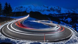 Photography of Curved Lighting Road